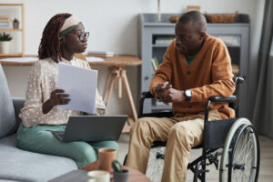 healthcare nurse at home with patient in wheelchair