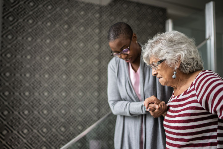 helping senior walk