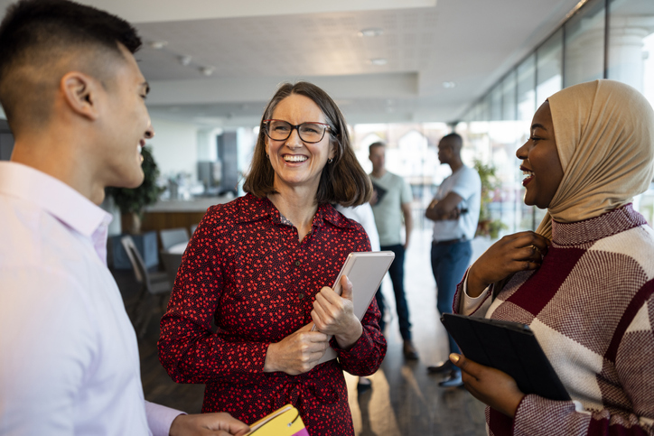 Mixed ethnic group of business professionals networking