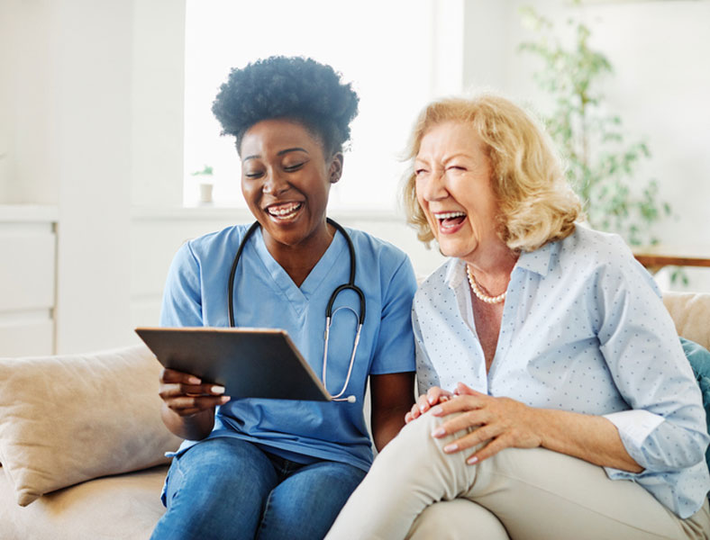 social worker and patient laughing together