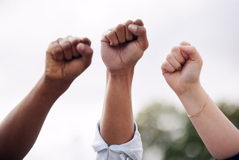 raising fists in protest of racism
