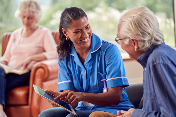 senior couple talking with social worker