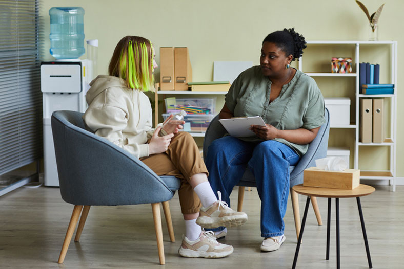 social worker talking with teen