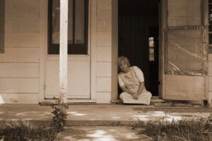 woman sitting in doorway